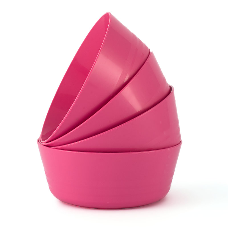 Stack of pink plastic bowls arrange in a curve to look like a prawn.